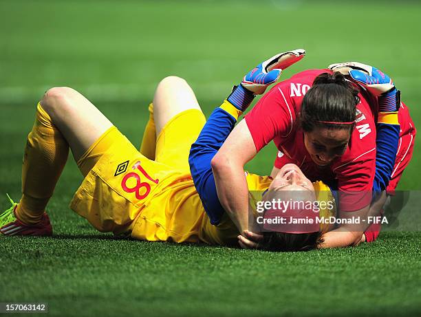 Rhian Wilkinson and Erin McLeod of Canada celebrate Bronze during the Women's Football Bronze Medal match between Canada and France, on Day 13 of the...