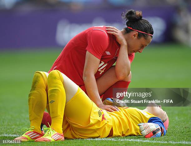 Melissa Tancredi of Canada tends to Erin McLeod of Canada between the Olympic womens bronze medal match between Canada and France on day 13 of the...