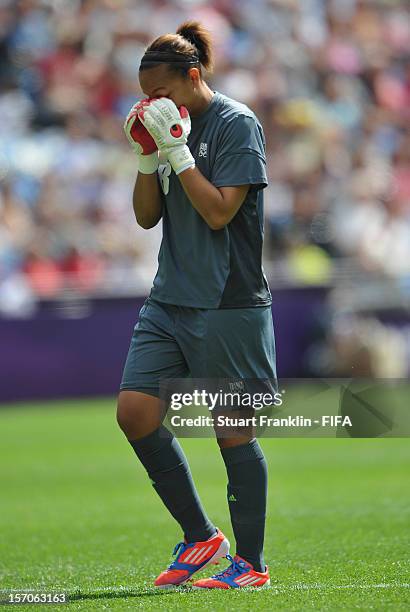 Sarah Bouhaddi of France reacts during the Olympic womens bronze medal match between Canada and France on day 13 of the London 2012 Olympic Games at...