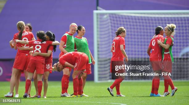 The players of Canada celebrate at the end of the Olympic womens bronze medal match between Canada and France on day 13 of the London 2012 Olympic...