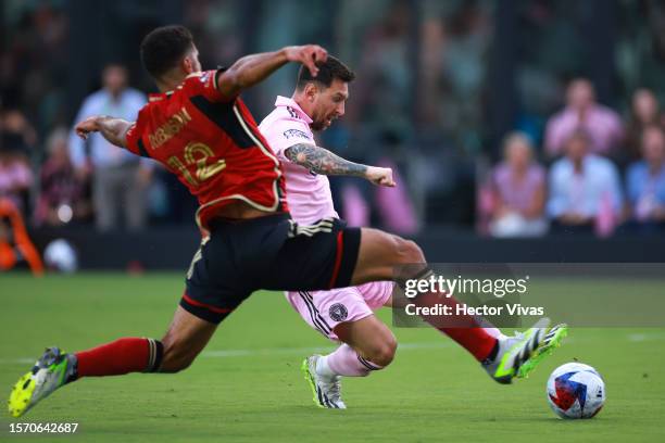 Lionel Messi of Inter Miami CF battles for the ball in the first half during the Leagues Cup 2023 match between Inter Miami CF and Atlanta United at...