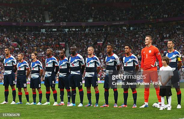 The team of Great Britain is pictured prior to the Men's Football first round Group A Match of the London 2012 Olympic Games between Great Britain...