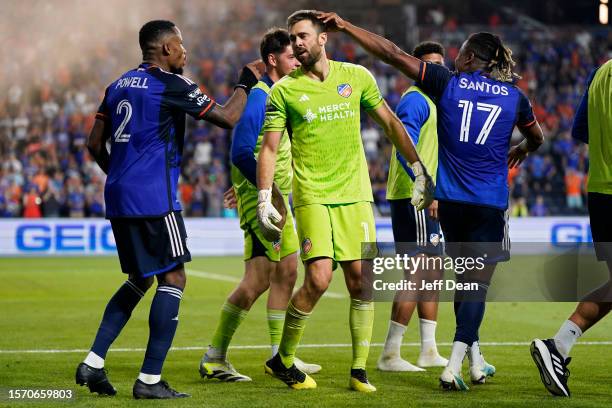 Alec Kann of FC Cincinnati celelbrates with teammates after making the game-winning save in a penalty shootout against Sporting Kansas City during a...