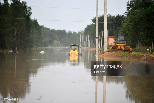 This photo taken on August 1, 2023 shows a submerged street after heavy rains in Zhuozhou, Baoding city, in China's northern Hebei province. / China...