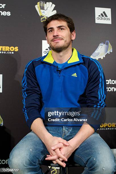 Real Madrid's goalkeeper Iker Casillas presents the new adidas Predator Boots and Soccer Gloves at the Soloporteros store on November 28, 2012 in...