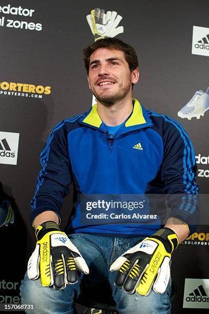 Real Madrid's goalkeeper Iker Casillas presents the new adidas Predator Boots and Soccer Gloves at the Soloporteros store on November 28, 2012 in...