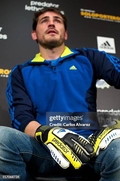 Real Madrid's goalkeeper Iker Casillas presents the new adidas Predator Boots and Soccer Gloves at the Soloporteros store on November 28, 2012 in...