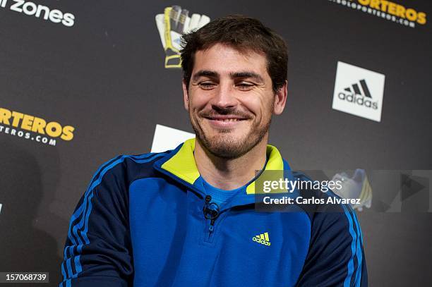 Real Madrid's goalkeeper Iker Casillas presents the new adidas Predator Boots and Soccer Gloves at the Soloporteros store on November 28, 2012 in...