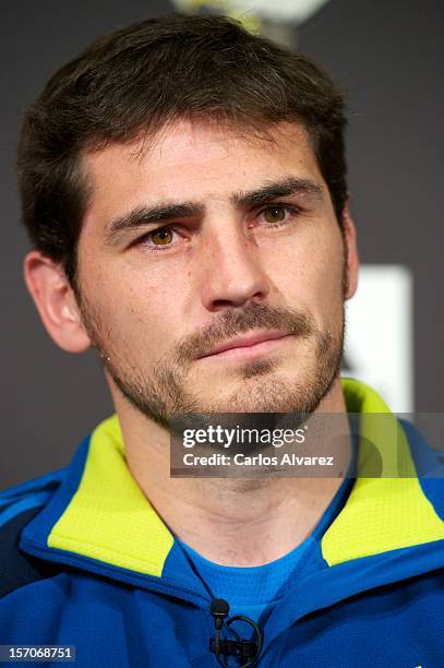 Real Madrid's goalkeeper Iker Casillas presents the new adidas Predator Boots and Soccer Gloves at the Soloporteros store on November 28, 2012 in...