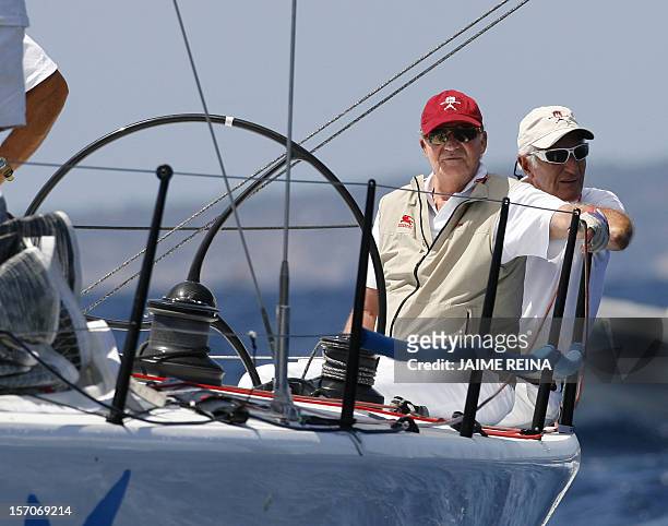 Spain's King Juan Carlos I sails on board of the ship Bribon on the second day of the Copa del Rey regatta in Palma de Mallorca on August 04, 2009....