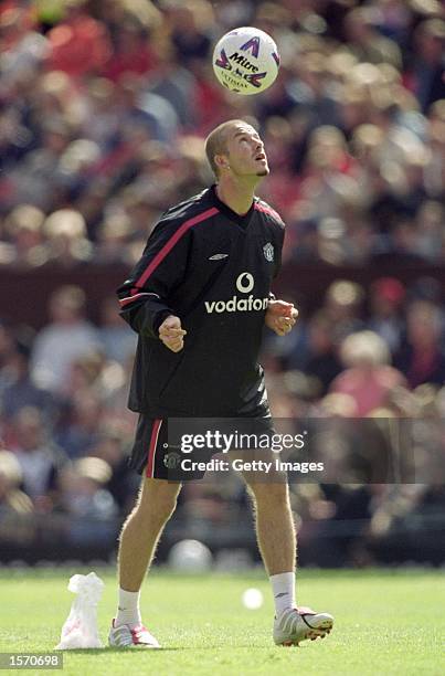 David Beckham of Manchester United controls the ball during a training session held at the Manchester United Open Day at Old Trafford, in Manchester,...