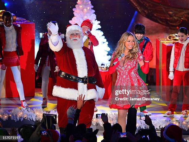 Santa Claus and Mariah Carey perform during a pre-tape performance for NBC's Christmas tree lighting at Rockefeller Center on November 27, 2012 in...