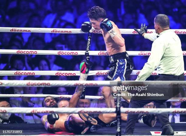 Naoya Inoue of Japan knocks down Stephen Fulton of the United States in the 8th round during their WBC & WBO Super Bantamweight Title Bout at Ariake...