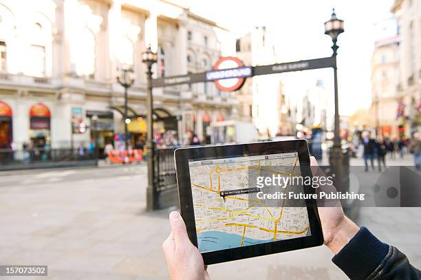 Man using Google Maps on an iPad to find his way around London, October 4, 2012.