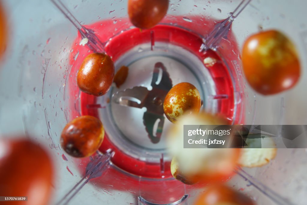 Fresh red date in the food processor view from above
