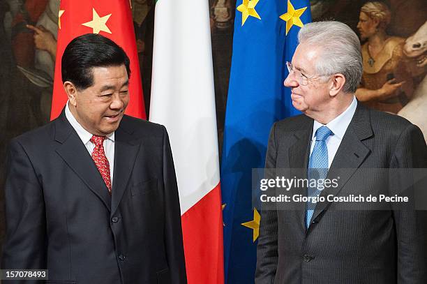 Jia Qinglin , Chairman of the National Committee of the Chinese People's Political Consultative Conference, stands with Italian Prime Minister Mario...