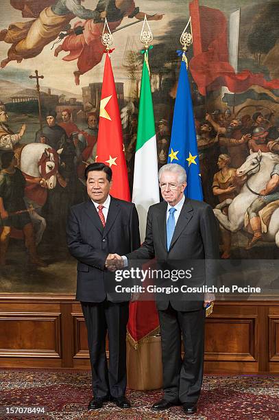 Jia Qinglin , Chairman of the National Committee of the Chinese People's Political Consultative Conference, shakes hand with Italian Prime Minister...