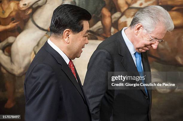 Jia Qinglin , Chairman of the National Committee of the Chinese People's Political Consultative Conference, walks with Italian Prime Minister Mario...