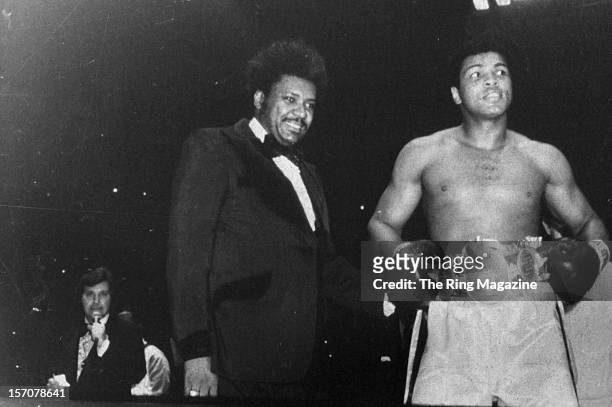 Muhammad Ali wears his belts in the ring after winning the fight against Chuck Wepner at Richfield Coliseum on March 24,1975 in Cleveland,Ohio....