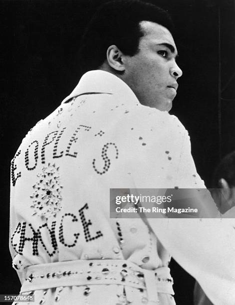 Muhammad Ali wears a cape "People's Choice" given to him by Elvis Presley before the fight against Joe Bugner at the Convention Center on February...