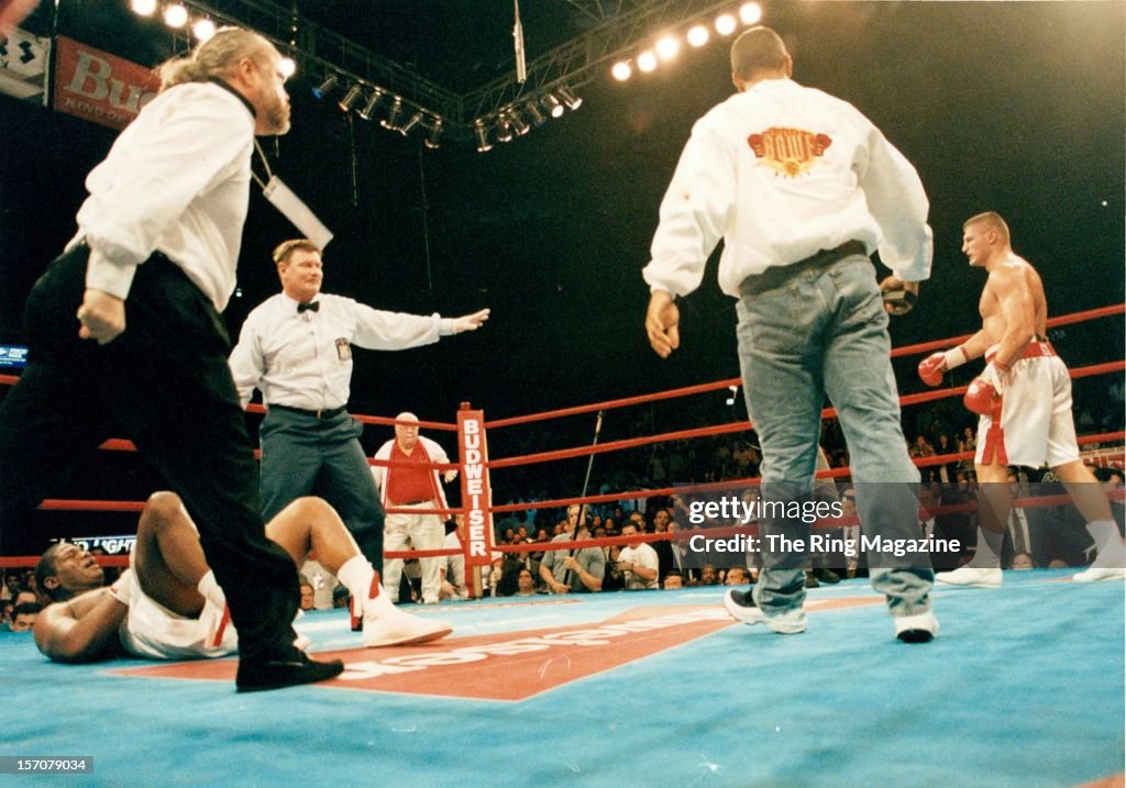 Riddick Bowe lays on the canvas after being knocked down by Andrew ...