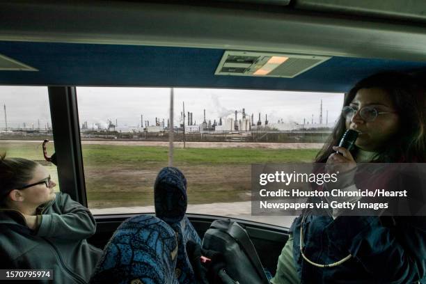 Yvette Arellano, right, speaks while passing a petrochemical plant during a tour dubbed a Toxic Tour on Saturday, Feb. 9 in Deer Park. The tour will...