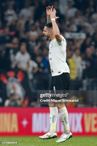 Renato Augusto of Corinthians celebrates after scoring the team's first goal during a semifinal first leg match between Corinthians and Sao Paulo as...