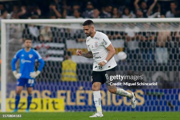 Renato Augusto of Corinthians celebrates after scoring the team's first goal during a semifinal first leg match between Corinthians and Sao Paulo as...
