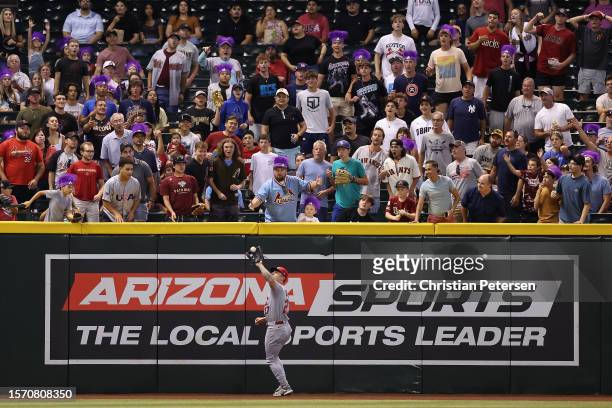 Outfielder Tyler O'Neill of the St. Louis Cardinals catches a fly-ball out during the first inning of the MLB game against the Arizona Diamondbacks...
