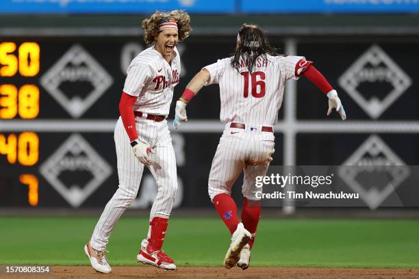 Brandon Marsh and Alec Bohm of the Philadelphia Phillies celebrate a walk-off single hit by Bohm to defeat the Baltimore Orioles at Citizens Bank...