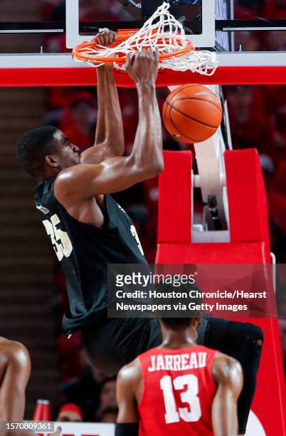 Central Florida forward Ryan Anders dunks over Houston guard Dejon Jarreau during the first half on a NCAA basketball game at Fertitta Center on...