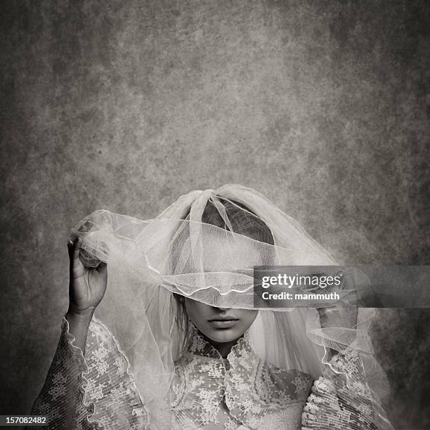 ghostly bride raising her veil - ghost bride stock pictures, royalty-free photos & images
