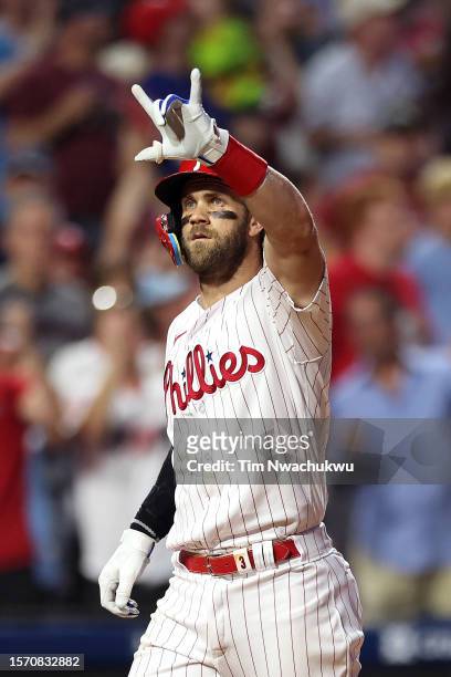 Bryce Harper of the Philadelphia Phillies looks on after hitting a solo home run during the sixth inning against the Baltimore Orioles at Citizens...