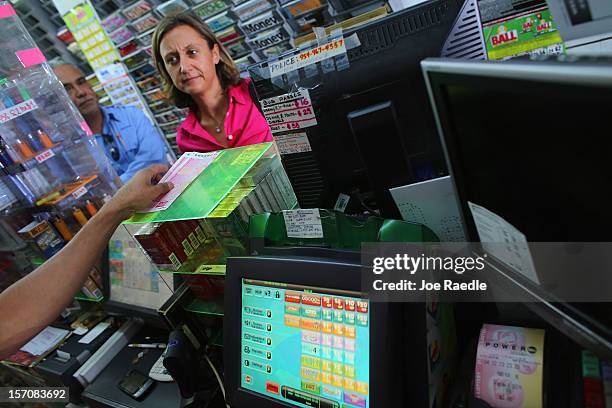 Alex Aubry buys Powerball tickets at Circle News Stand on November 28, 2012 in Hollywood, Florida. The jackpot for Wednesday's Powerball drawing is...