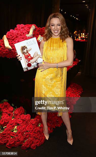 Kylie Minogue attends a photocall to launch her new book 'Kylie/Fashion' at Harrods on November 28, 2012 in London, England.