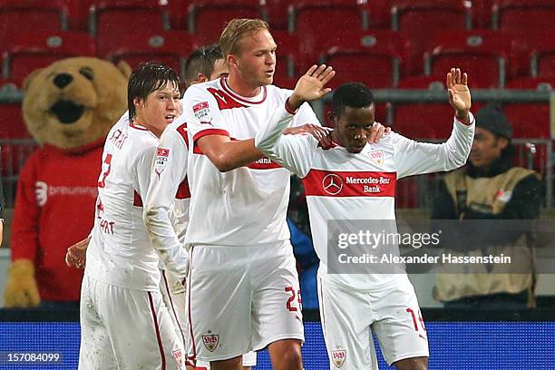 Ibrahima Traore of Stuttgart celebrates scoring the opening goal with his team mates during the Bundesliga match between VfB Stuttgart and FC...