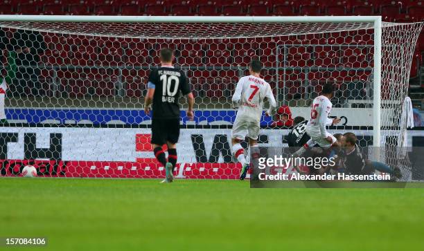 Ibrahima Traore of Stuttgart scores the opening goal with his team mates during the Bundesliga match between VfB Stuttgart and FC Augsburg at...