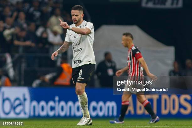 Renato Augusto of Corinthians celebrates after scoring the team's second goal during a semifinal first leg match between Corinthians and Sao Paulo as...