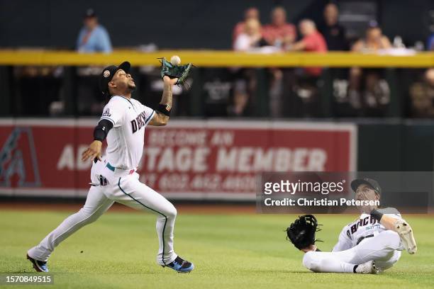 Infielder Ketel Marte of the Arizona Diamondbacks catches a fly-ball out during the third inning of the MLB game against the St. Louis Cardinals at...