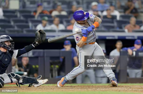 Francisco Alvarez of the New York Mets is hit with a pitch on his hand as he strikes out during the ninth inning against the New York Yankees at...