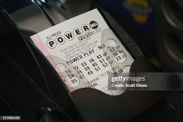 Powerball lottery ticket is printed for a customer at a 7-Eleven store on November 28, 2012 in Chicago, Illinois. Jim Bayci, who owns the store,...