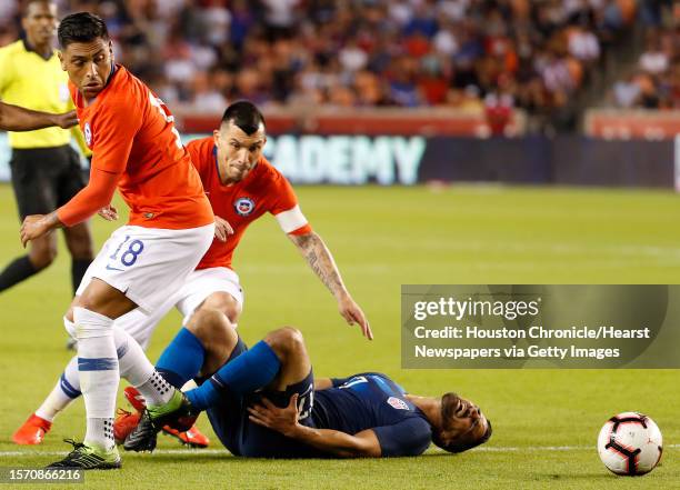 Chile defender Gonzalo Jara goes after a ball after colliding with United States midfielder Sebastian Lletget during the second half of an...