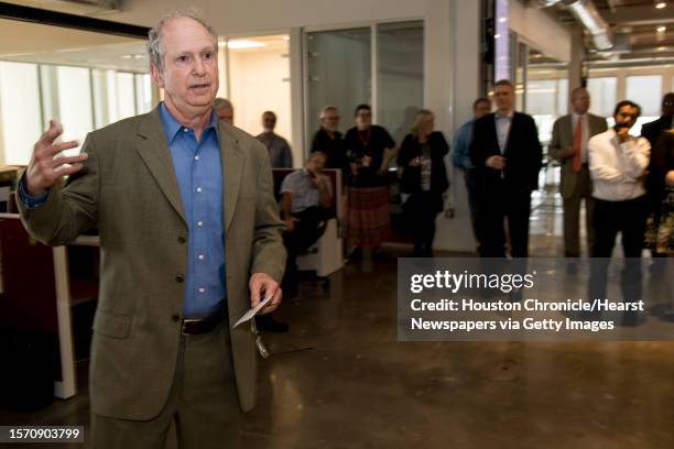 Steve Riley, left, speaks to the newsroom after he was named the Houston Chronicle's new executive editor on Thursday, May 2 in Houston. Riley has...