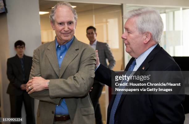 Steve Riley, left, is named the Houston Chronicle's new executive editor by John McKeon, publisher and Hearst Texas Newspapers president, on...