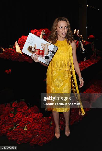 Kylie Minogue attends a photocall to launch her new book 'Kylie/Fashion' at Harrods on November 28, 2012 in London, England.