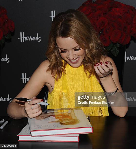 Kylie Minogue attends a photocall to launch her new book 'Kylie/Fashion' at Harrods on November 28, 2012 in London, England.