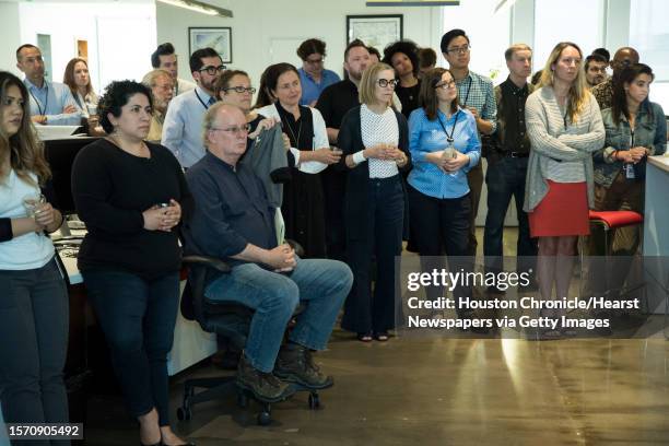 Newsroom employees listen as Steve Riley speaks after he was named the Houston Chronicle's new executive editor on Thursday, May 2 in Houston. Riley...