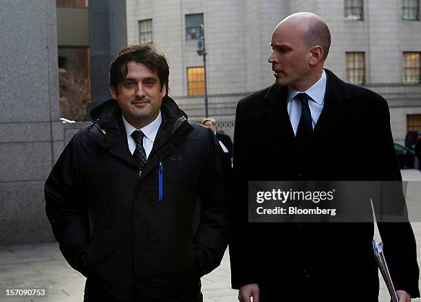 Paul Ceglia, indicted on charges of mail fraud and wire fraud, left, arrives with his attorney, Dean Boland, at federal court in New York, U.S., on...