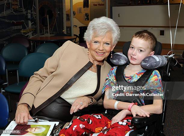 Elf On The Shelf" author Carol Aebersold visits with Ian at Boston Children's Hospital on November 28, 2012 in Boston, Massachusetts.