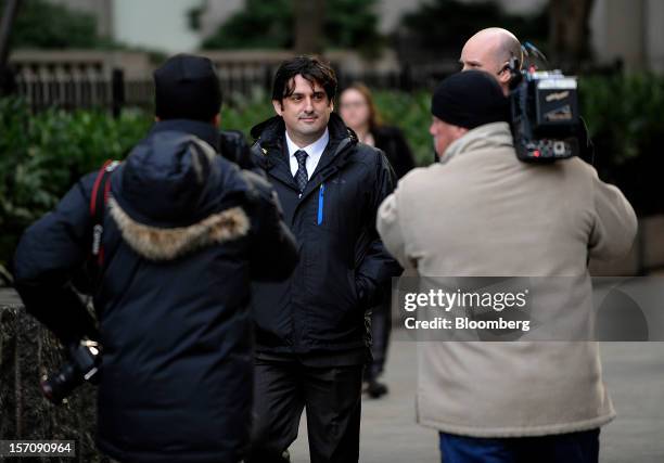 Paul Ceglia, indicted on charges of mail fraud and wire fraud, center, exits federal court in New York, U.S., on Wednesday, Nov. 28, 2012. Ceglia...